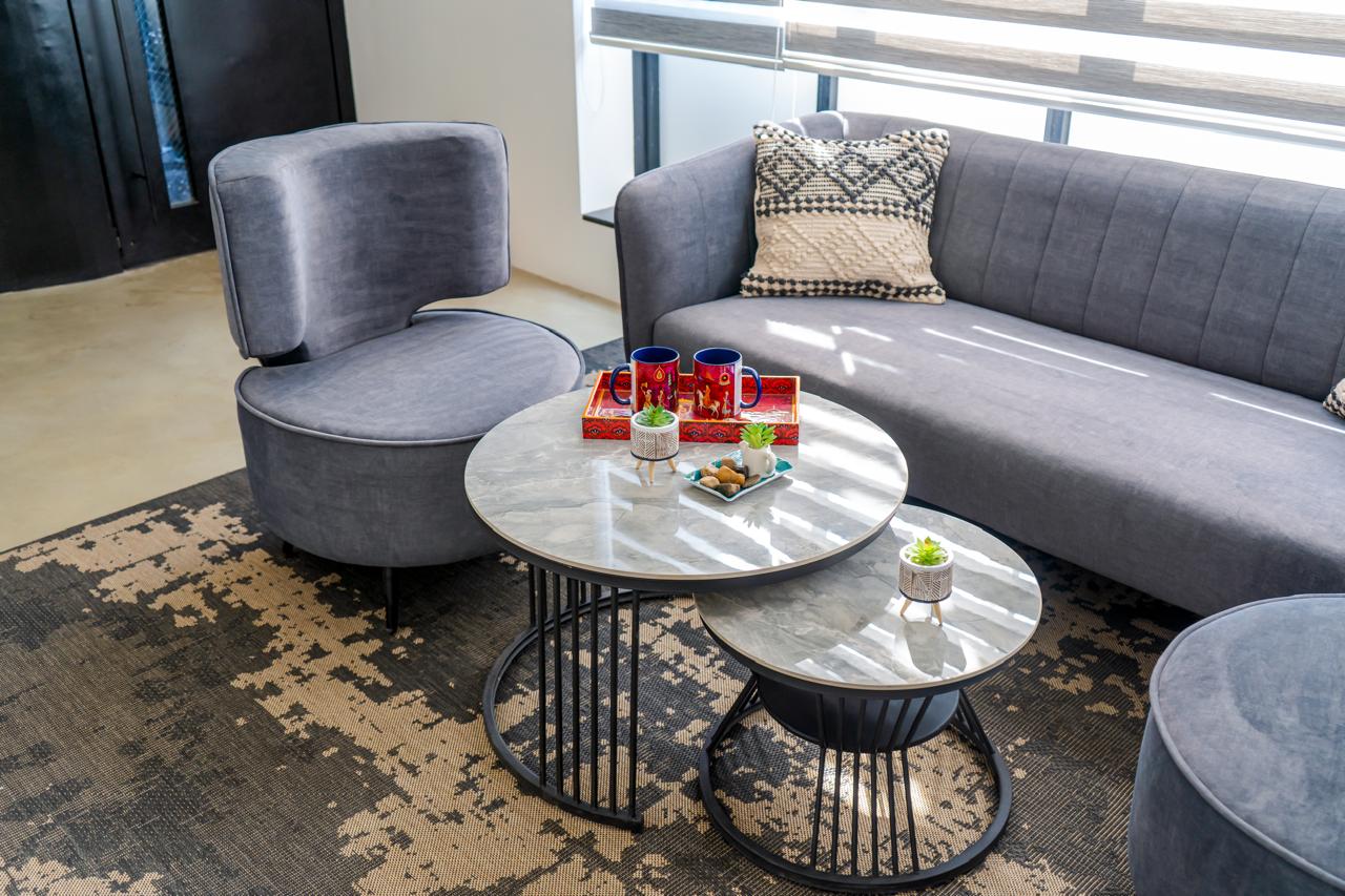 Detail view of nested marble coffee tables in lounge